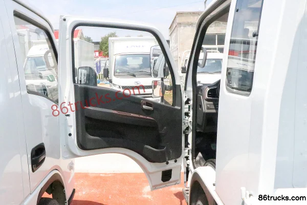 Yuejin Fuxing S100V 2.3L diesel 130 hp 4X2(6 wheels) Mengwo 5-speed 3.805m semi-row flatbed mini truck Cab (1) | 86Trucks